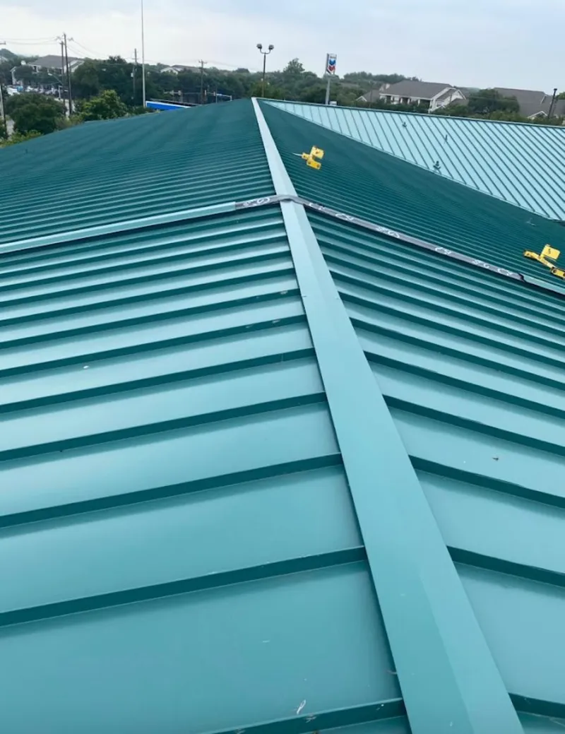 Green commercial metal roof ridge and valley for Metal Roof Repair in Grayling